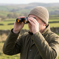 Compact binoculars being used outdoors