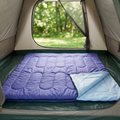 Double sleeping bag laid out inside a tent