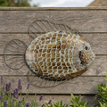 Flat fish wall art on a timber garden fence