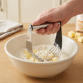 Pastry blender in use cutting butter into flour