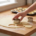 Pastry cutters being used to make jam tart pastry rounds