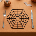 Spider web placemat in a Halloween table setting