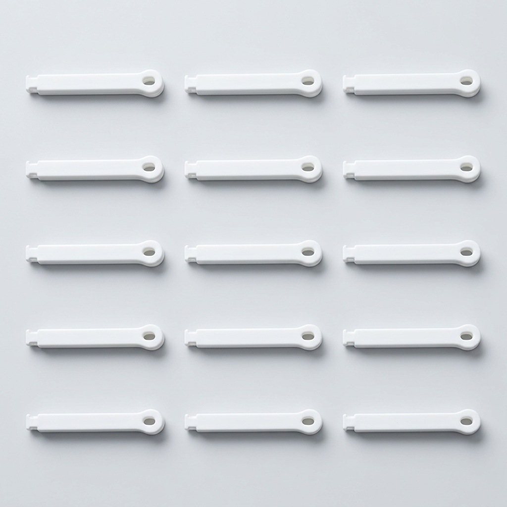 White bag clips arranged in three rows of five